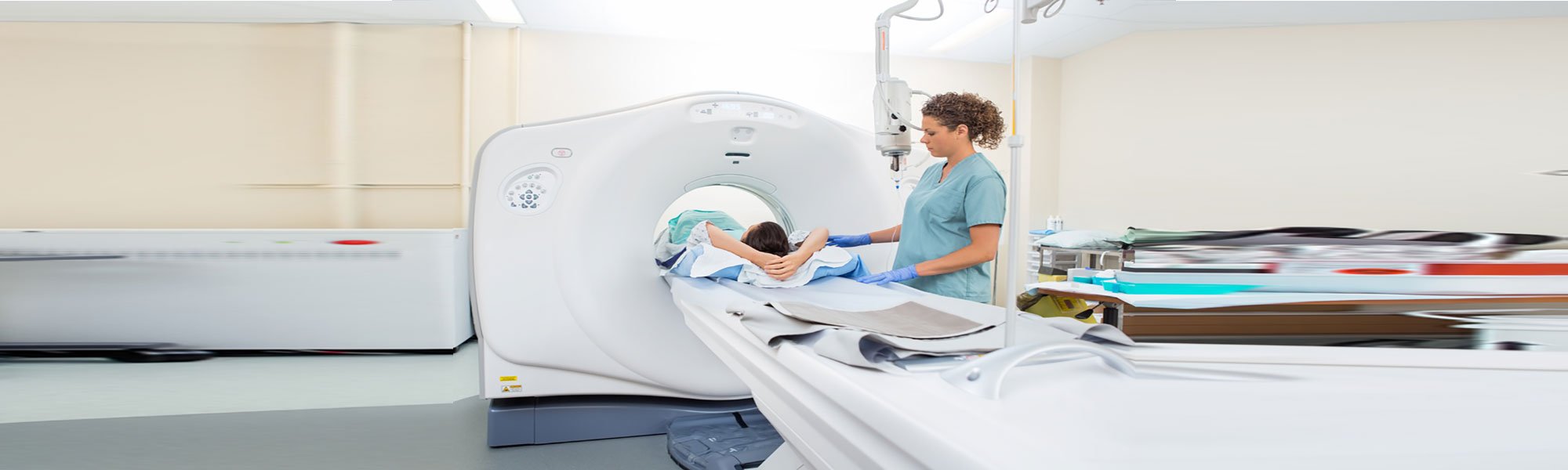 patient in mri machine with worker